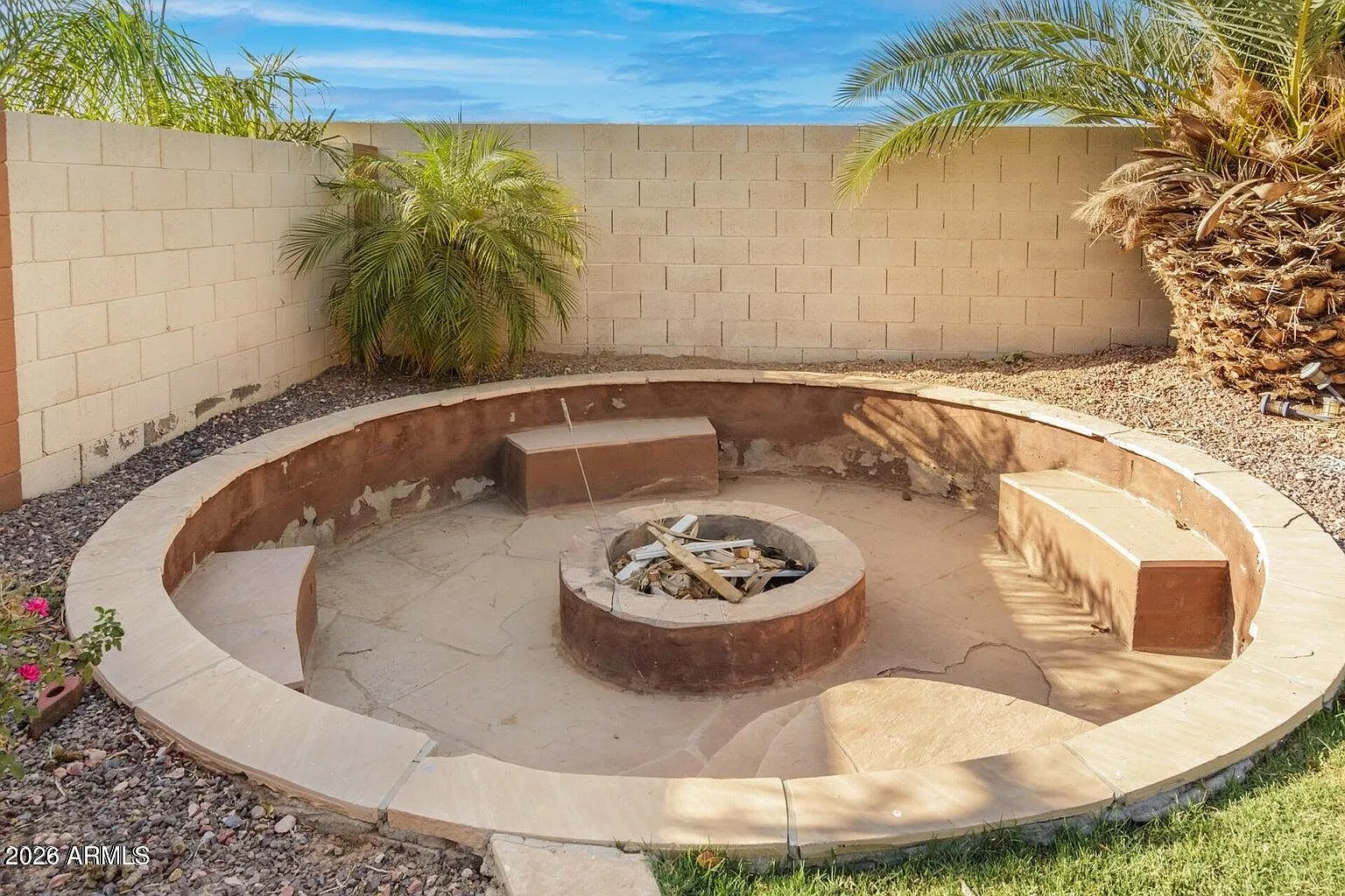 Sunken fire pit with built-in bench seating