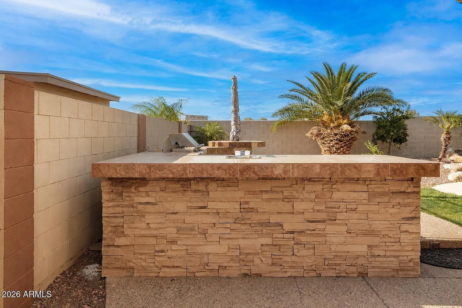 Outdoor kitchen counter with built-in grill and beverage cooler