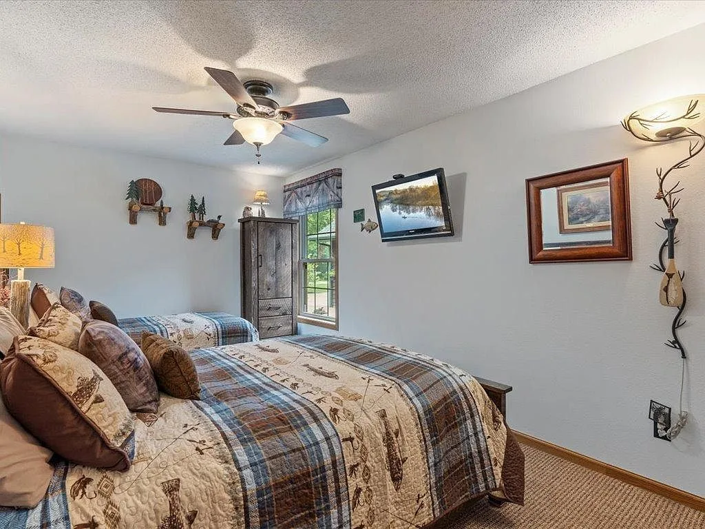 Guest bedroom with neutral paint and natural light