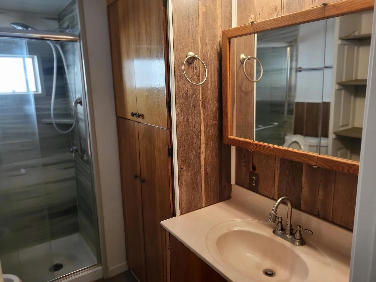 Bathroom with rustic wood paneling