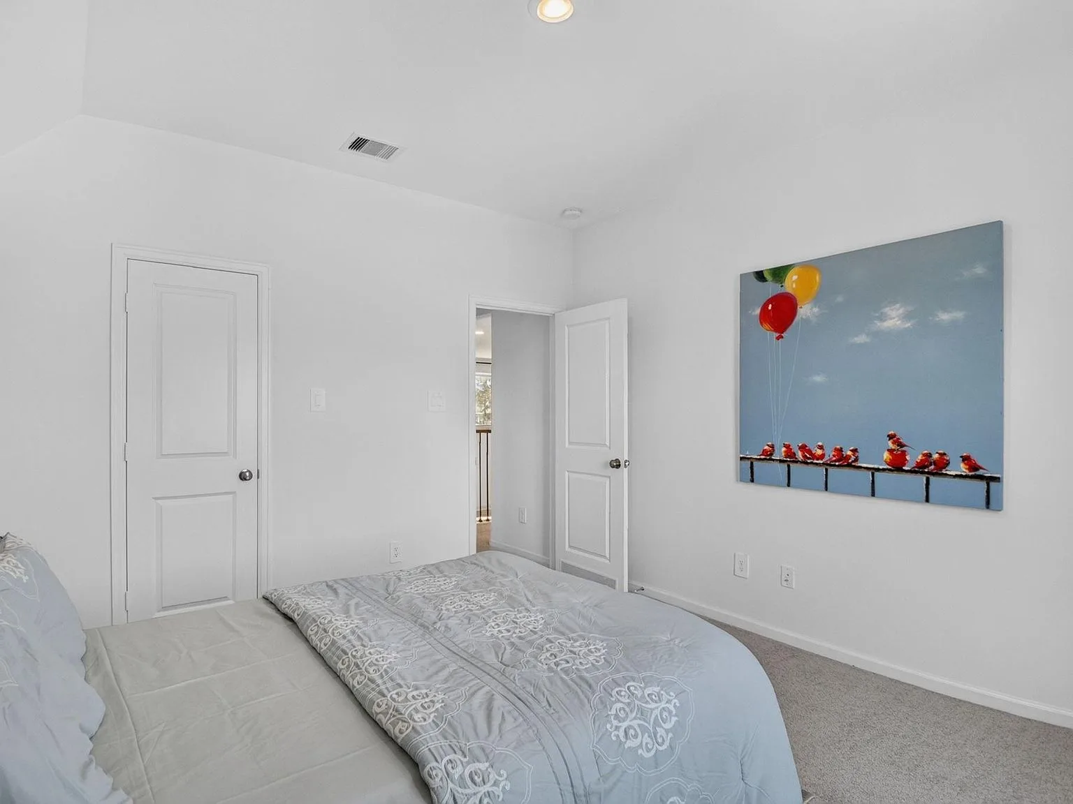 Spare bedroom with white walls and gray carpet ready for your own finishes