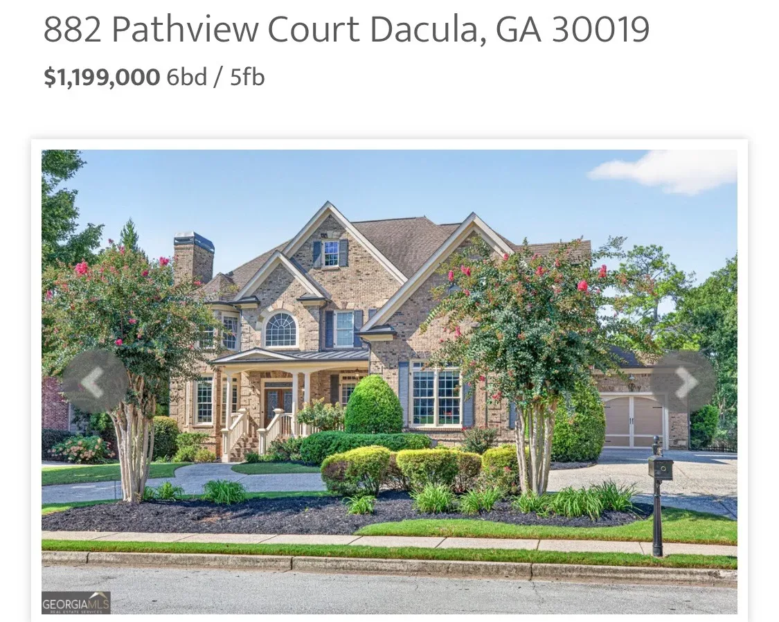 Brick facade of 882 Pathview Ct, just listed estate home in The Oaks at Apalachee Farms Dacula Georgia