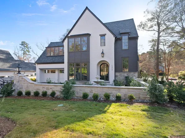 Modern brick and siding home typical of The Hills at Southpoint Toll Brothers construction