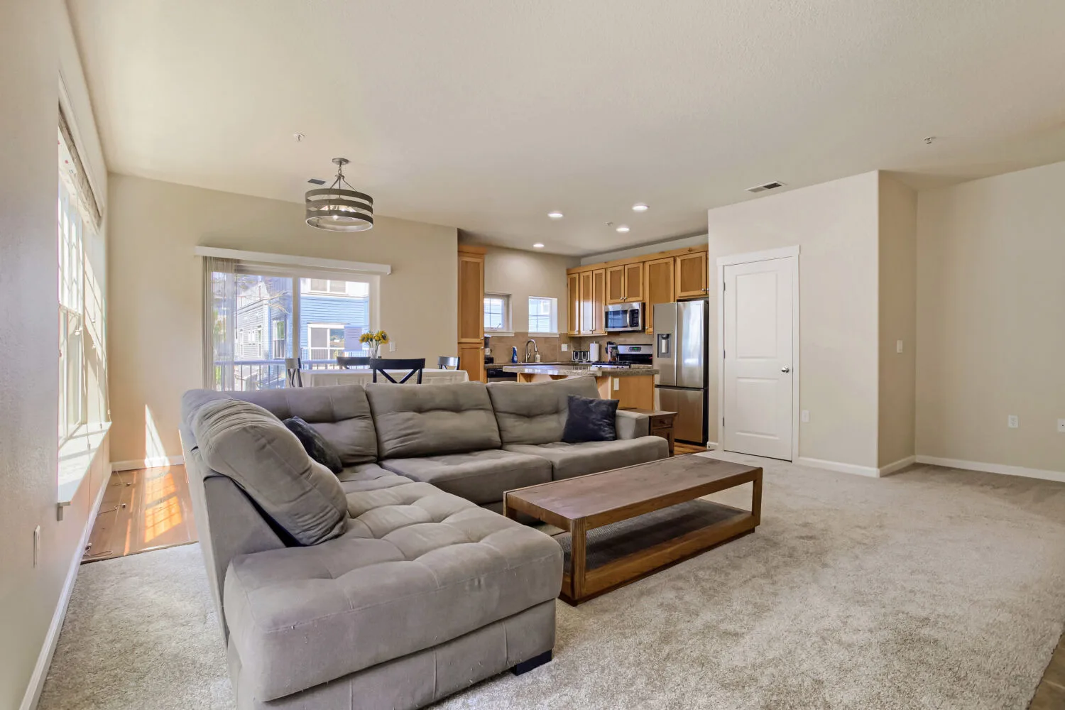Open-concept living and dining area at athe townhouse at 22862 SW Forest Creek Dr #203, Sherwood, OR