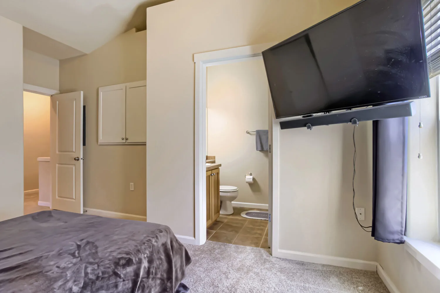 Primary bedroom connecting to a bathroom at athe townhouse at 22862 SW Forest Creek Dr #203, Sherwood, OR