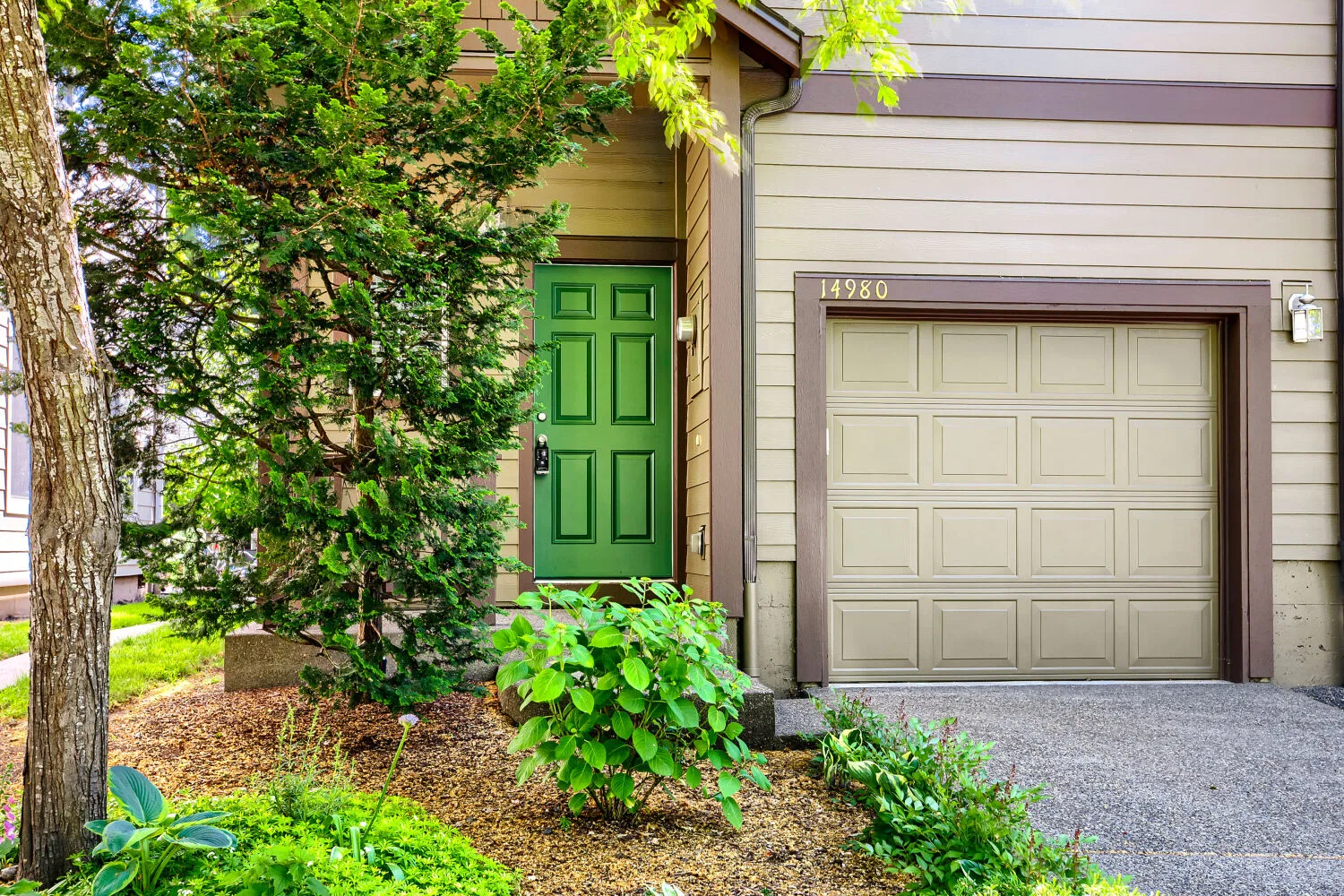 Front facade and entry of the attached townhome at 14980 SW Conor Cir, Beaverton, OR