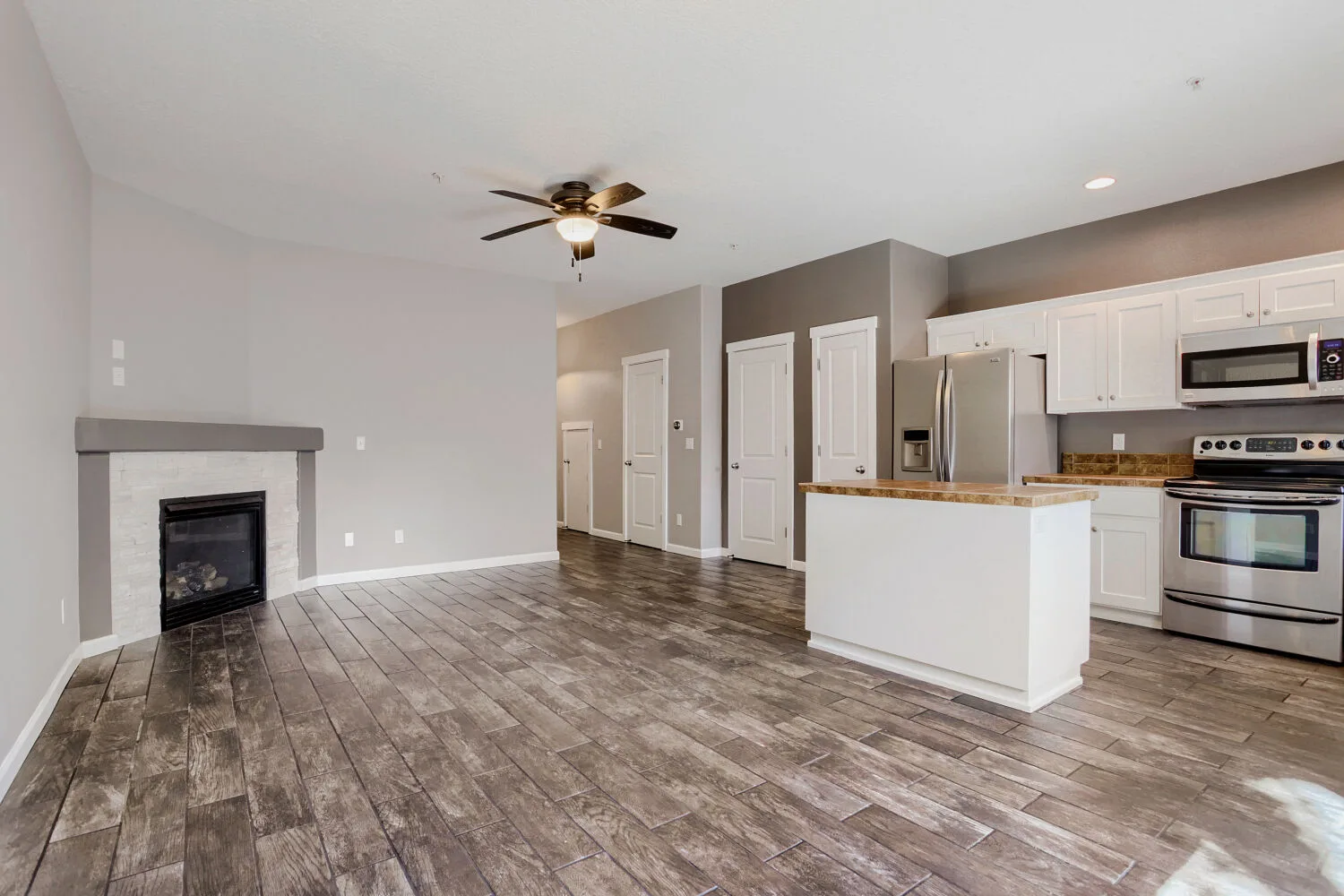 Open living and kitchen area at the townhome at 14980 SW Conor Cir, Beaverton, OR