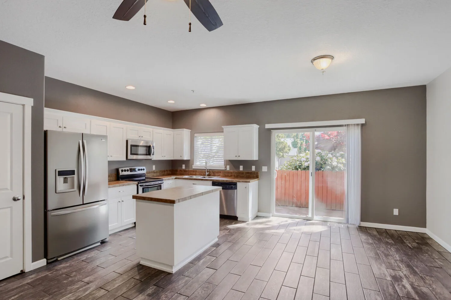 Modern kitchen with stainless steel appliances at the townhome at 14980 SW Conor Cir, Beaverton, OR