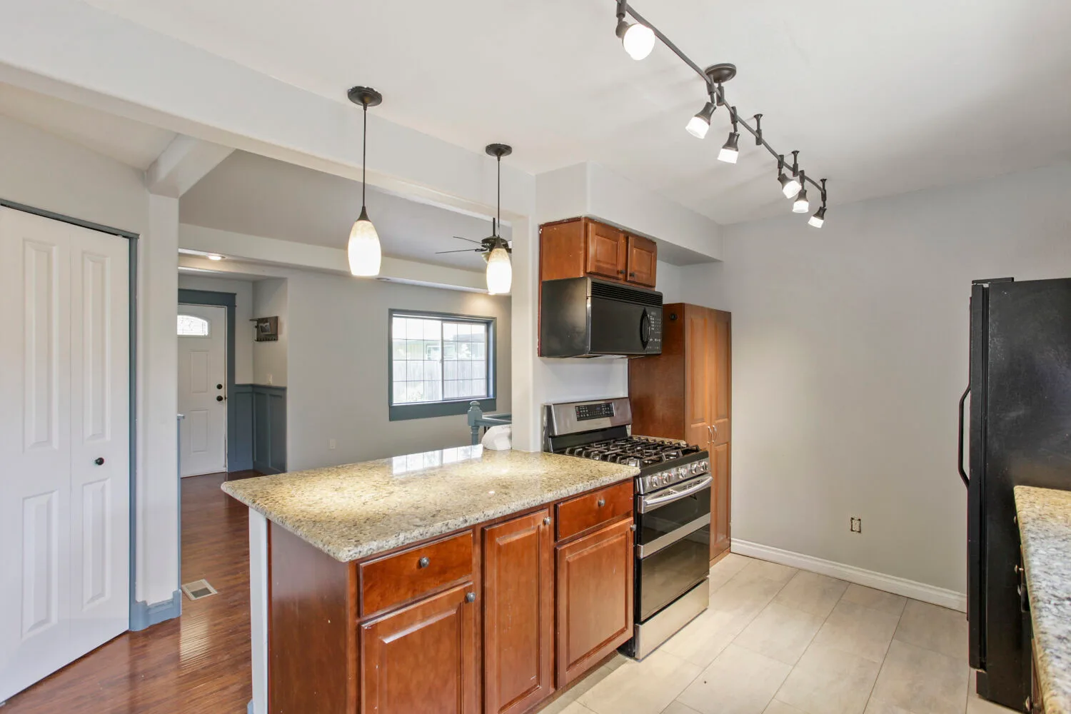 Kitchen with wood cabinets and island at 6314 SE Jennings Ave, Milwaukie, OR