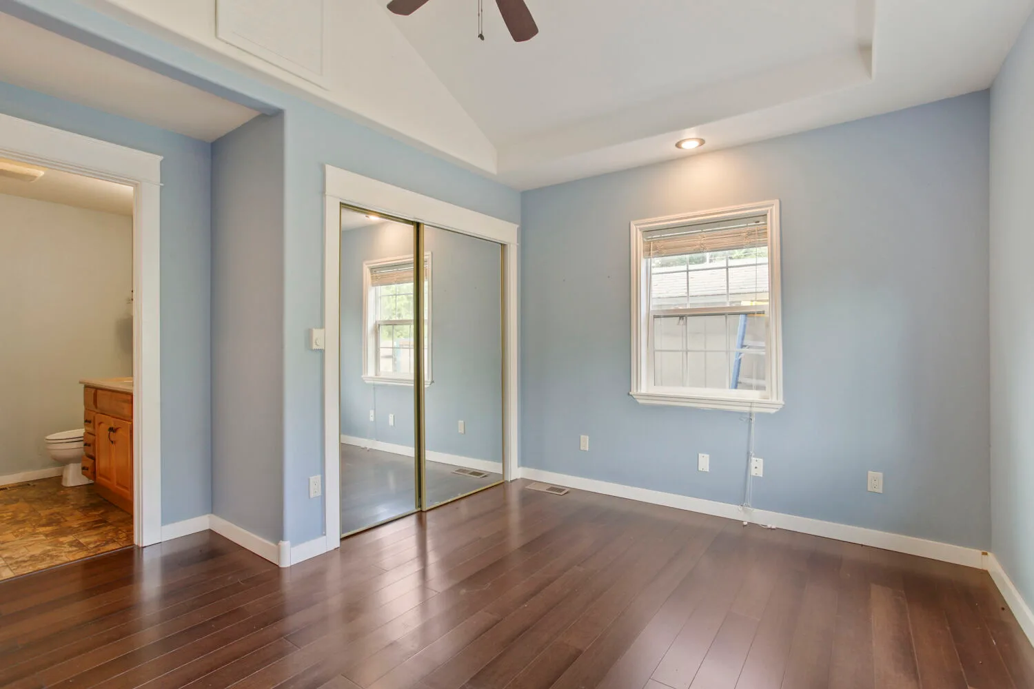 Bedroom with blue walls and vaulted ceiling at 6314 SE Jennings Ave, Milwaukie, OR
