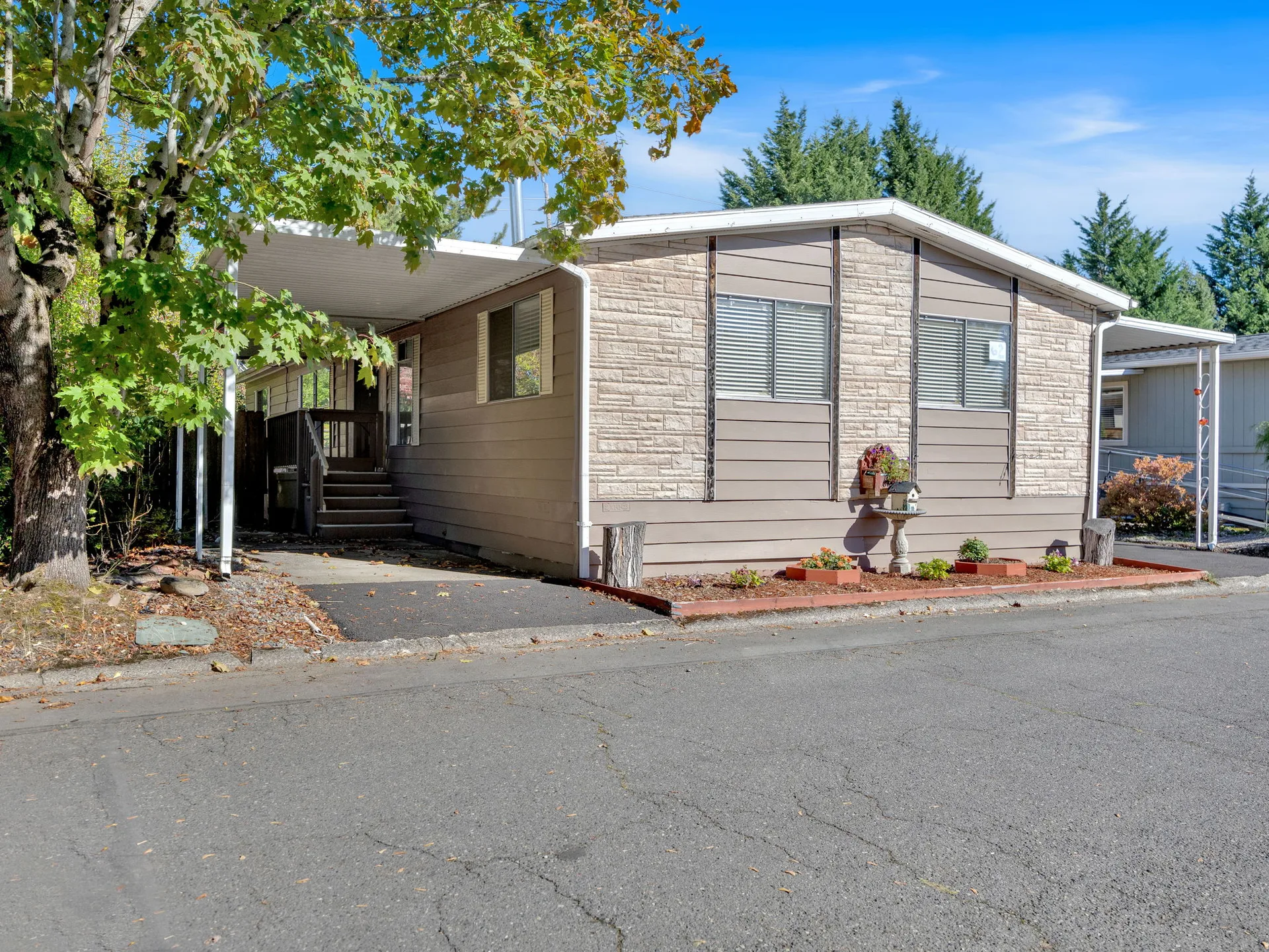 Exterior facade of the manufactured home at 21100 NE Sandy Blvd #62, Fairview, OR