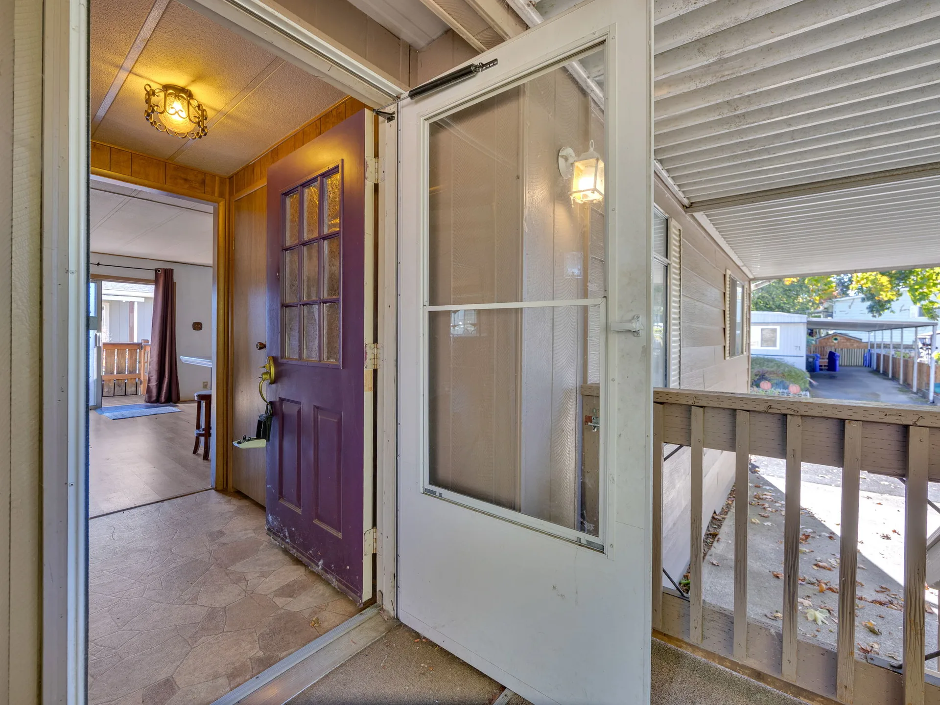Front door opening from the porch at 21100 NE Sandy Blvd #62, Fairview, OR