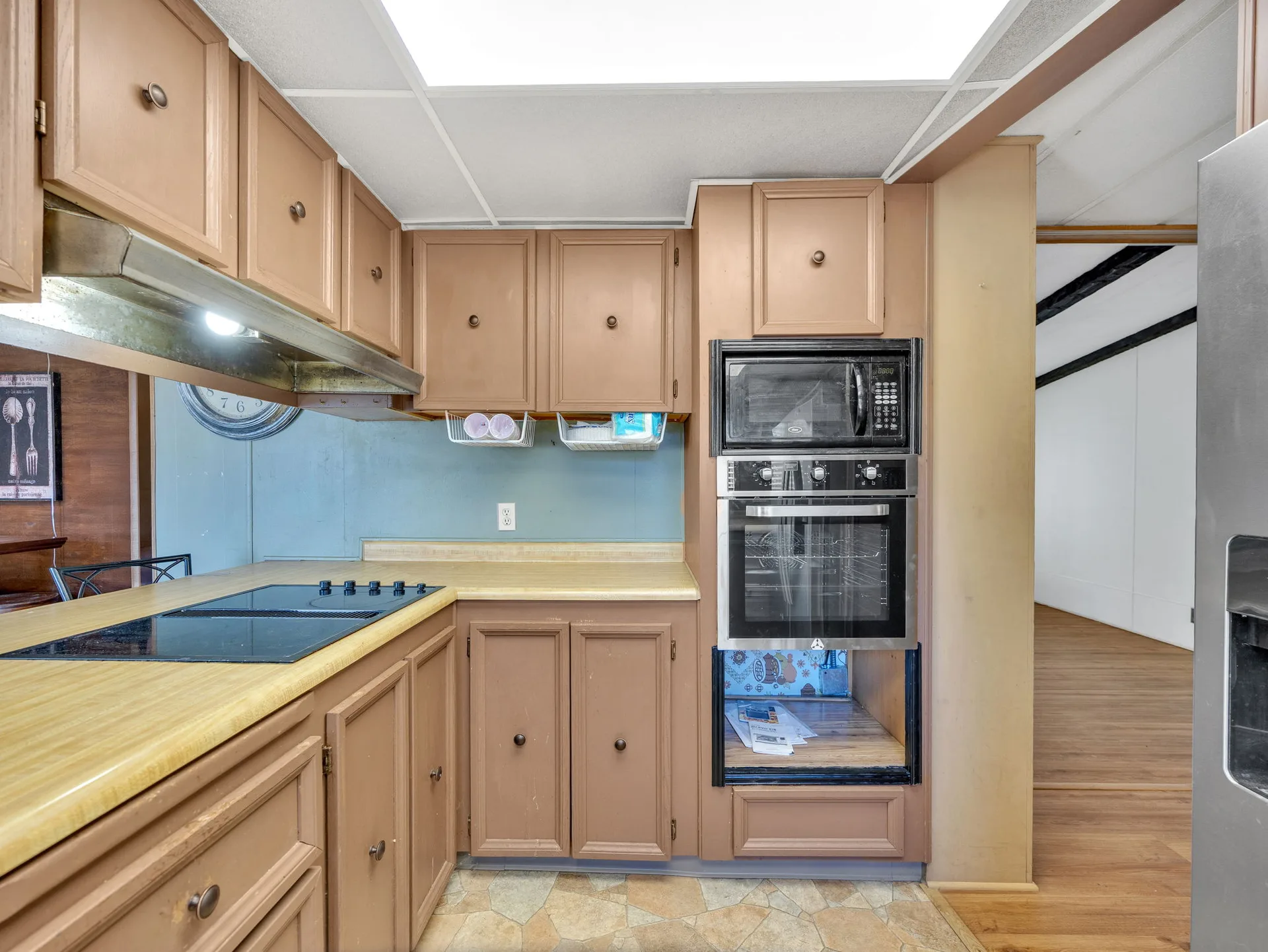 Kitchen with wood cabinetry at 21100 NE Sandy Blvd #62, Fairview, OR