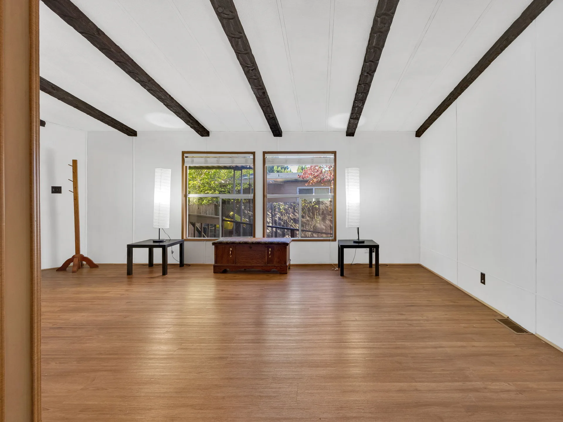 Living room with exposed ceiling beams at 21100 NE Sandy Blvd #62, Fairview, OR
