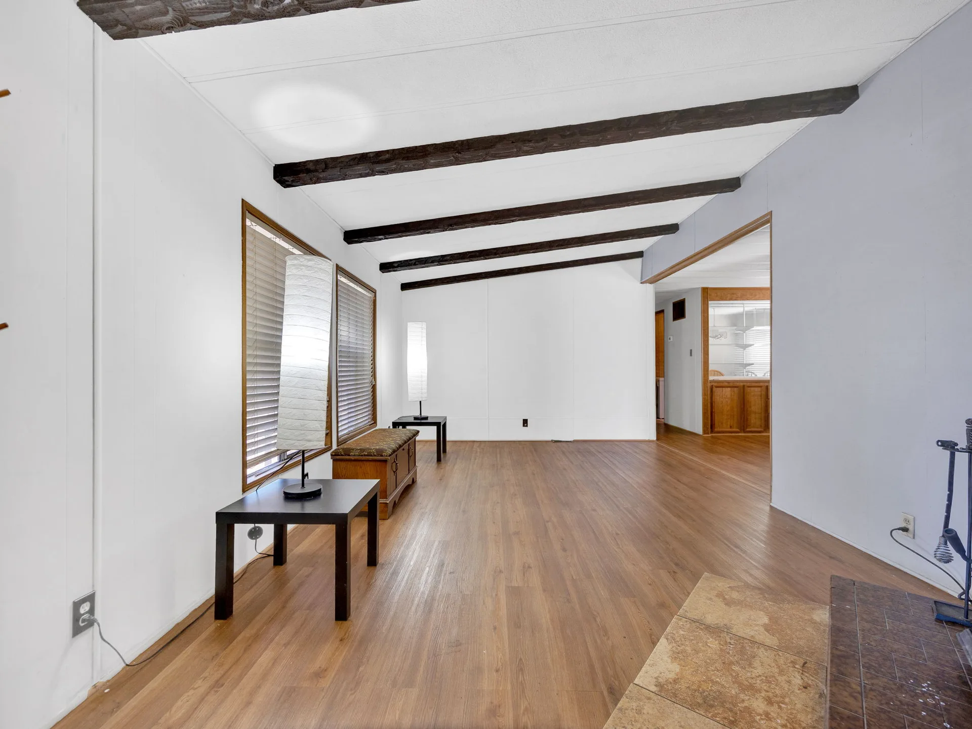 Wide living room view with exposed beams at 21100 NE Sandy Blvd #62, Fairview, OR