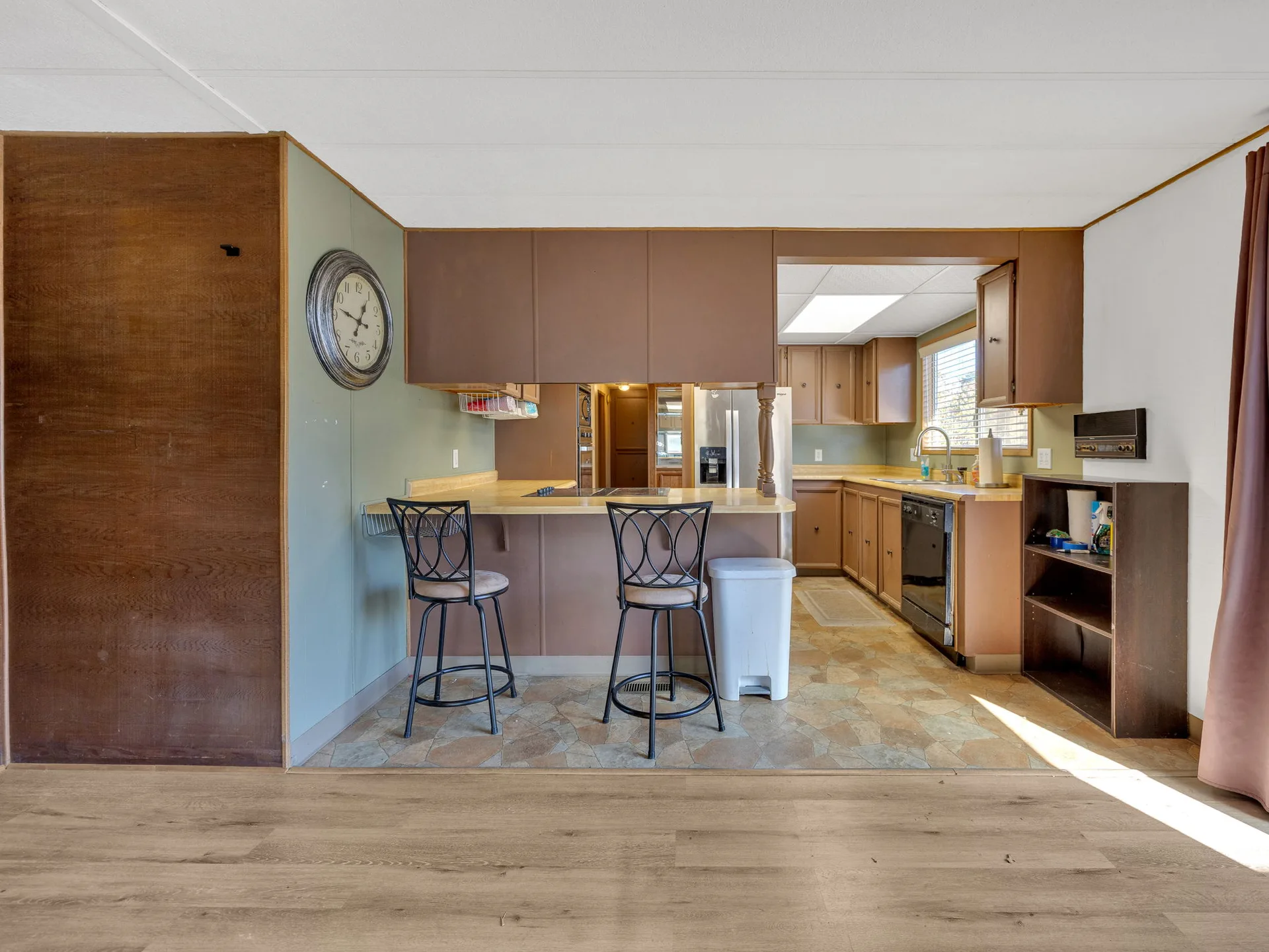 Kitchen pass-through bar viewed from the dining area at 21100 NE Sandy Blvd #62, Fairview, OR