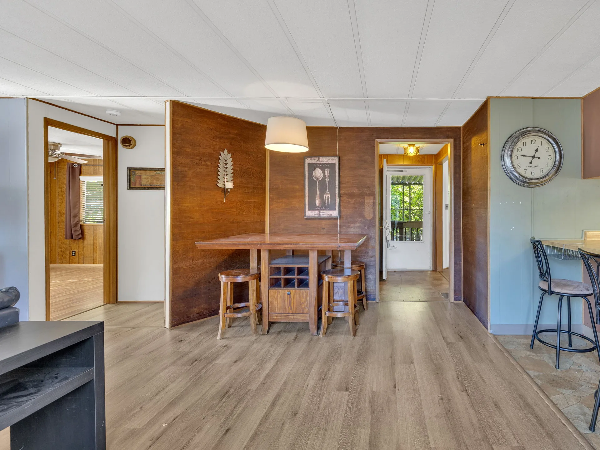 Dining room with wood paneling at 21100 NE Sandy Blvd #62, Fairview, OR