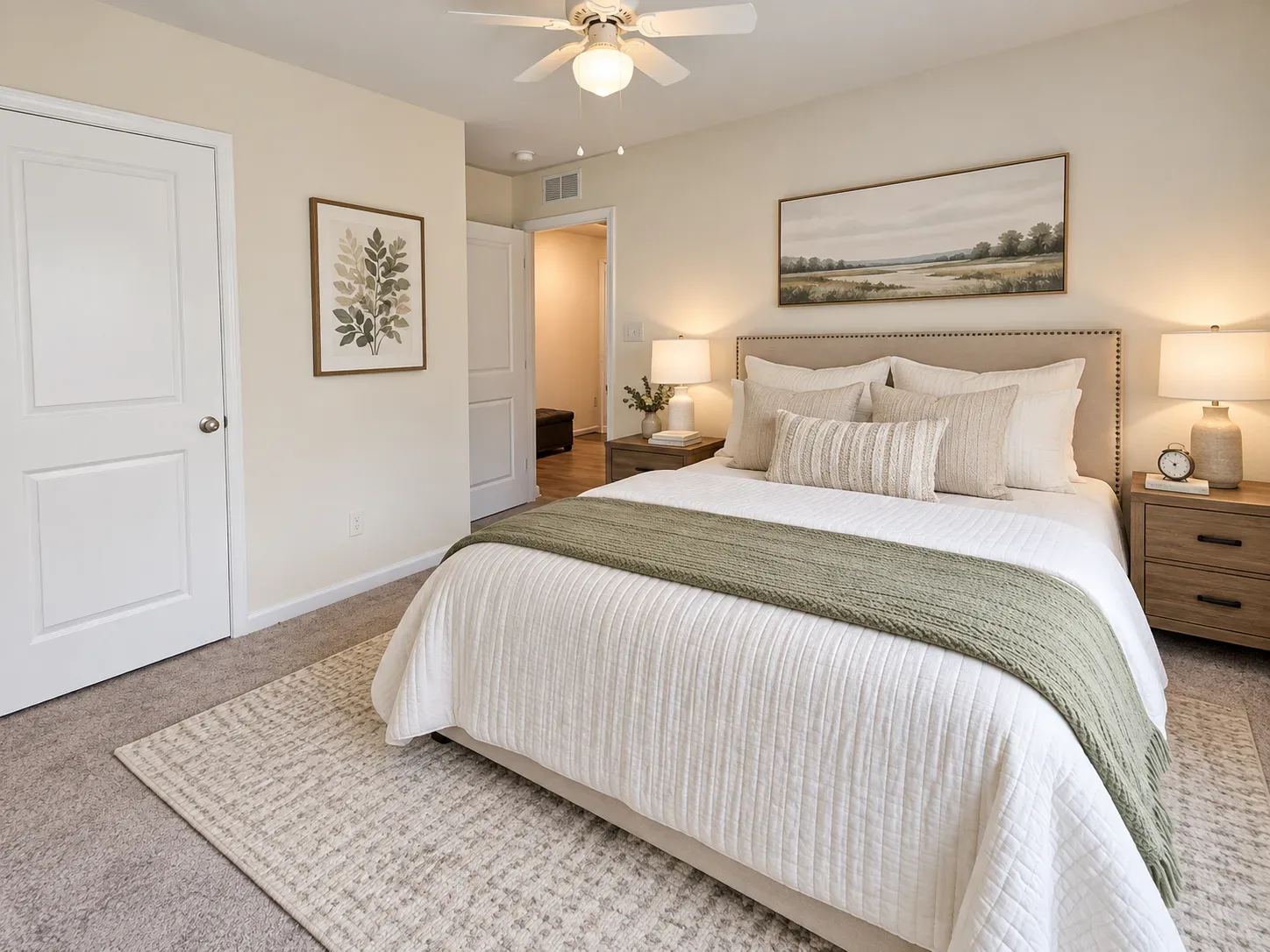 Primary bedroom with neutral finishes and a ceiling fan in Ladysmith Village