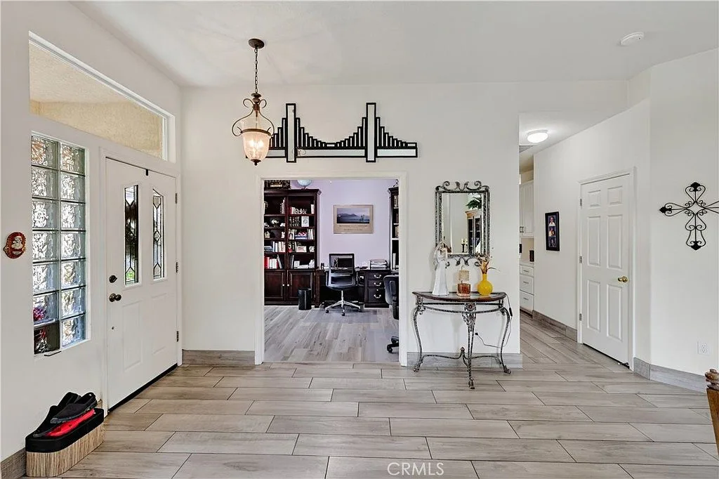 The foyer, lit by transom windows above the door