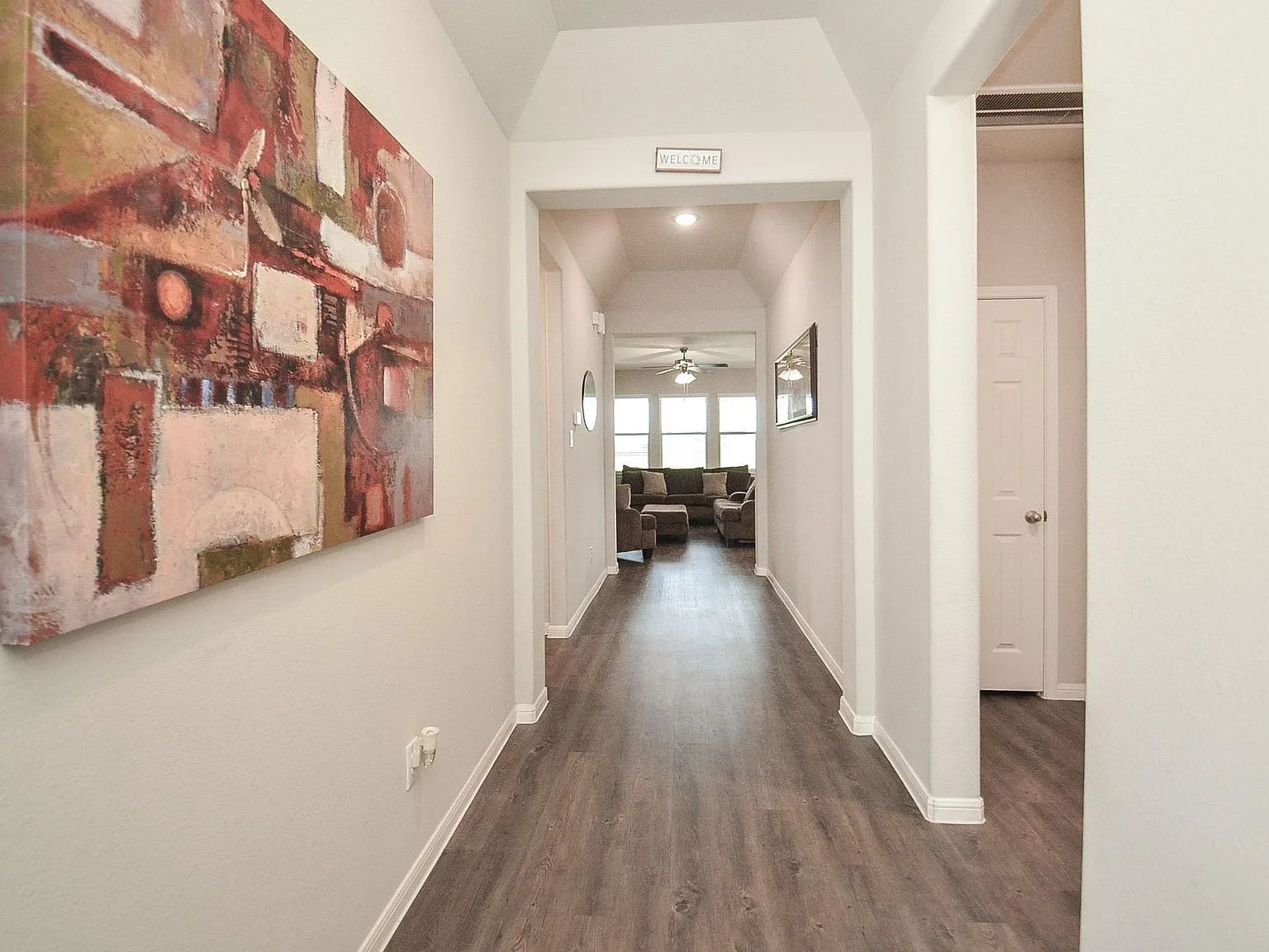 Entryway hallway opening into the open-concept living area