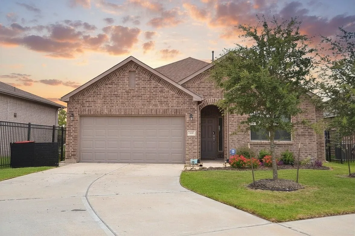 Front exterior of 137 Eliana Shores Dr bathed in sunset light