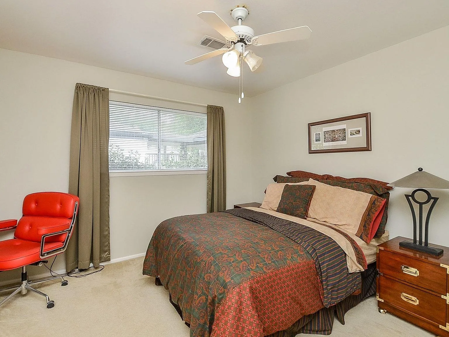 Bedroom interior with neutral walls and soft natural light