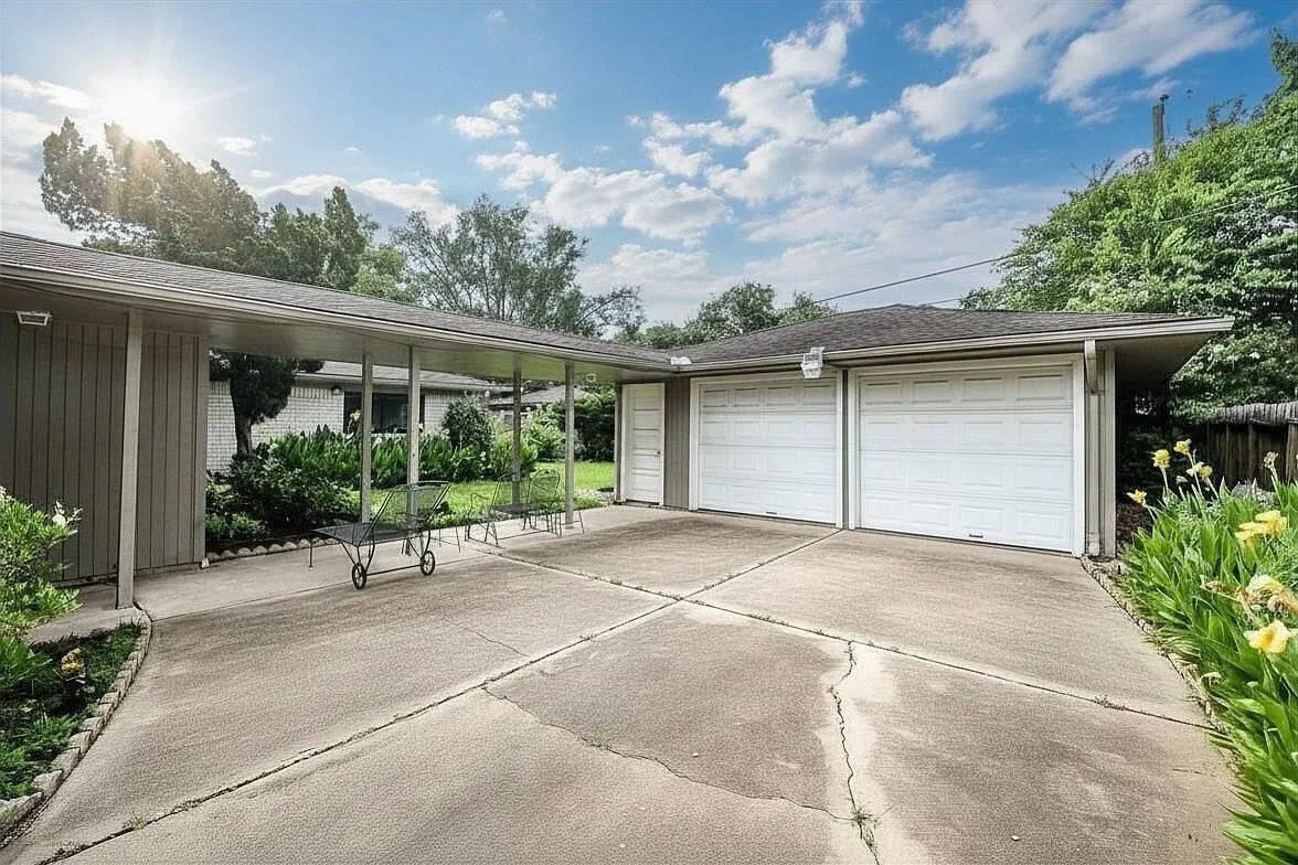 Covered carport and two-car garage at 6203 Wigton Dr