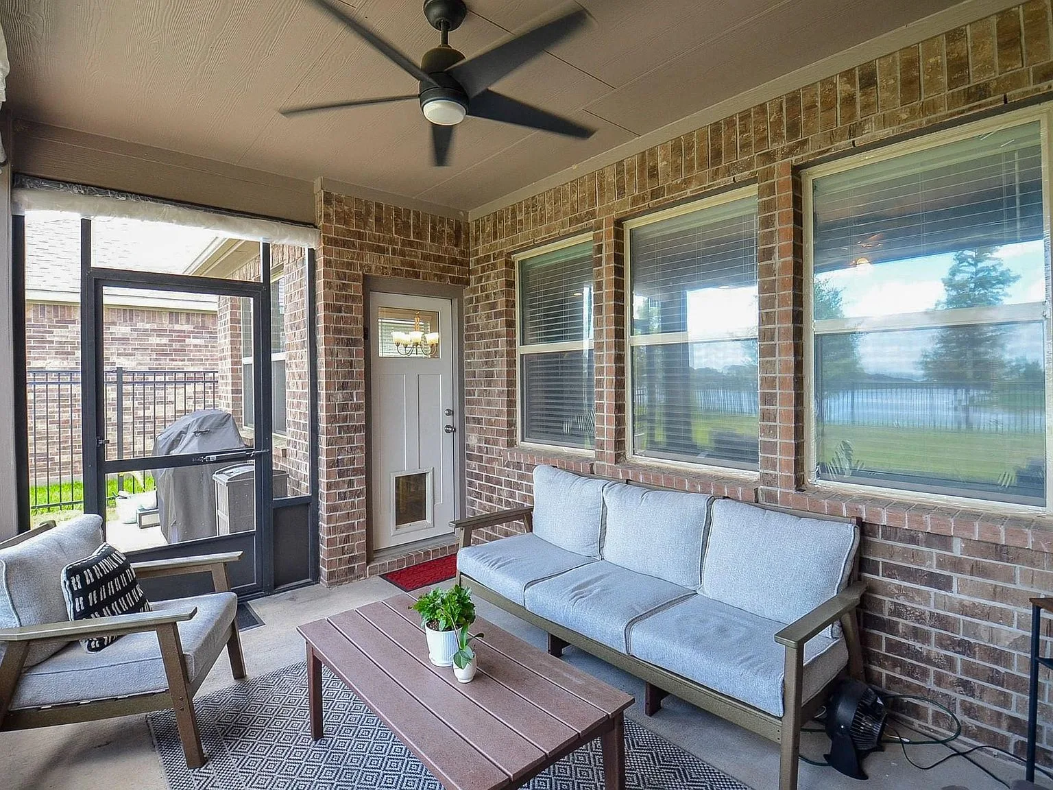Covered screened patio overlooking the backyard