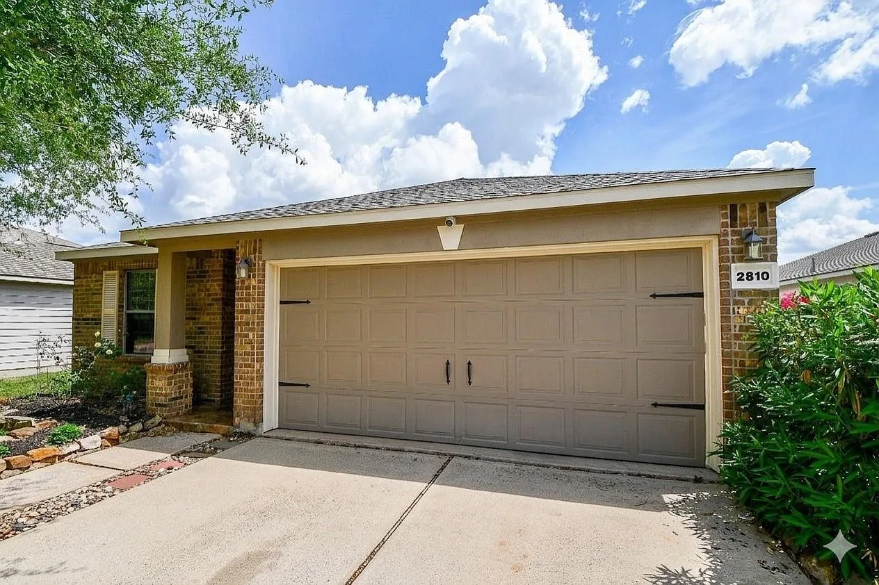 Two-car garage and front garden