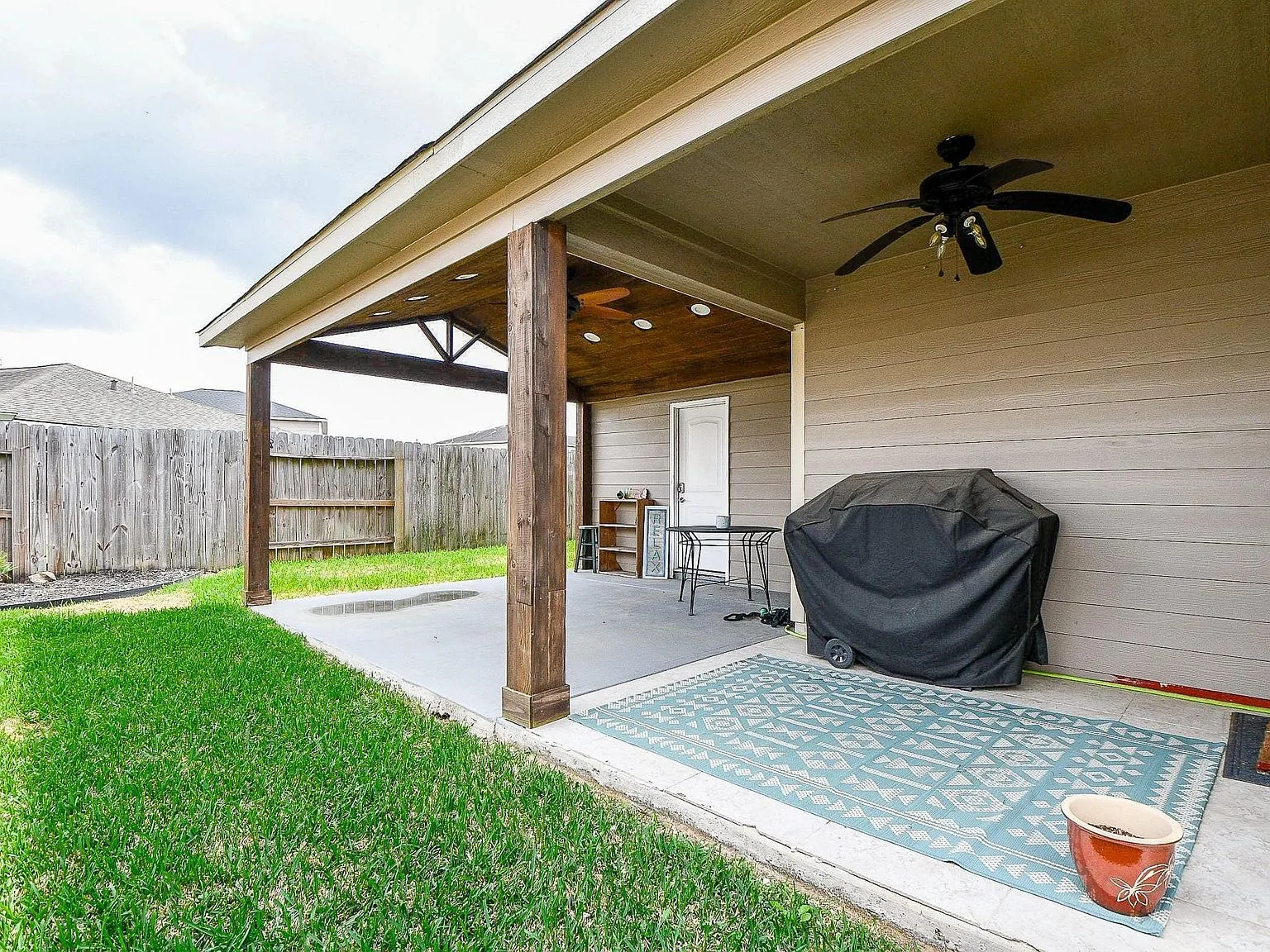 Covered patio and backyard