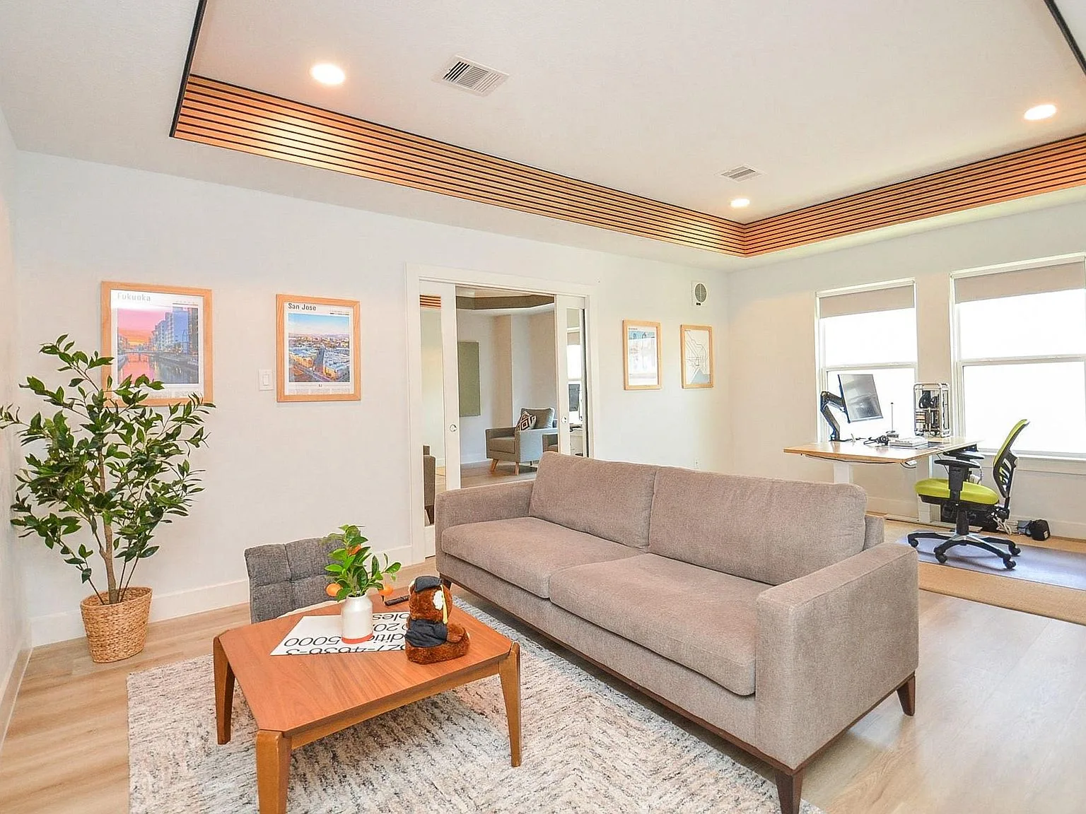 Flex space with acoustic wood slat tray ceiling detail