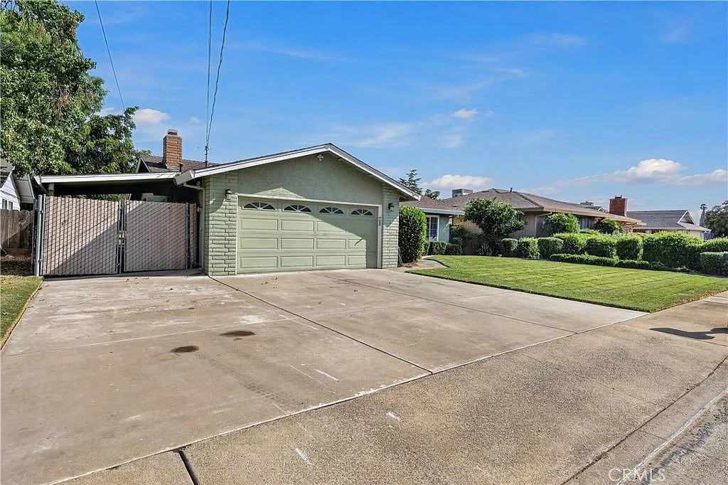 Street view of the single-story home at 385 Emerald Dr with its attached garage and concrete driveway