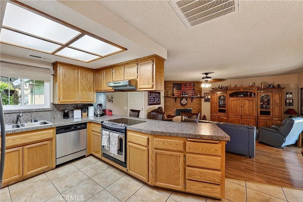 Updated kitchen with granite look counters open to the family room