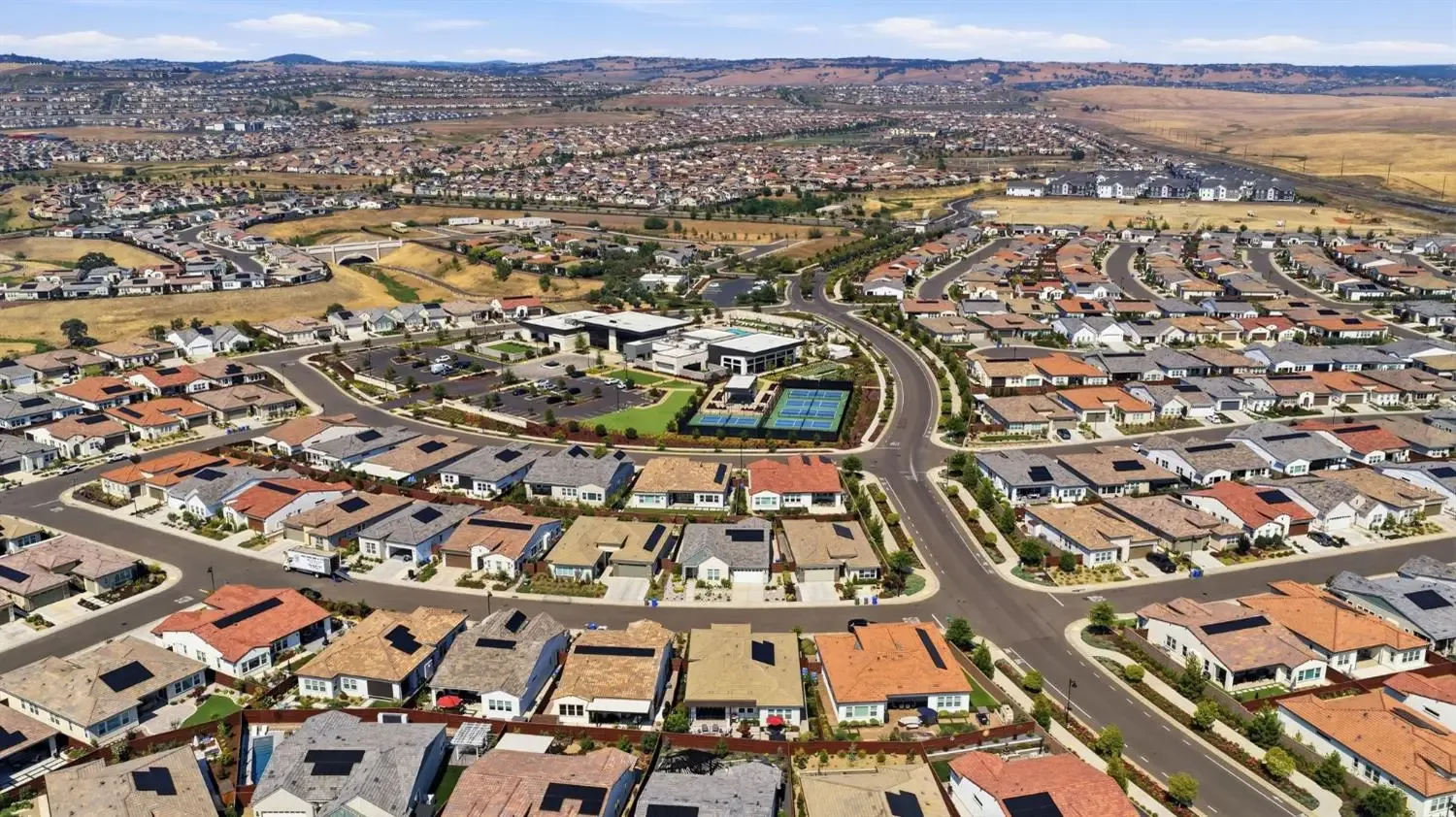 Aerial view of the residential community at Regency at Folsom Ranch in Folsom, California, showing single-story homes and landscaped streets