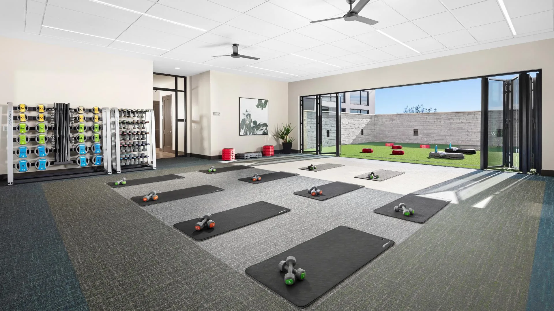 Fitness and yoga studio at Regency at Folsom Ranch in Folsom, California, part of the amenity package buyers evaluate with monthly costs