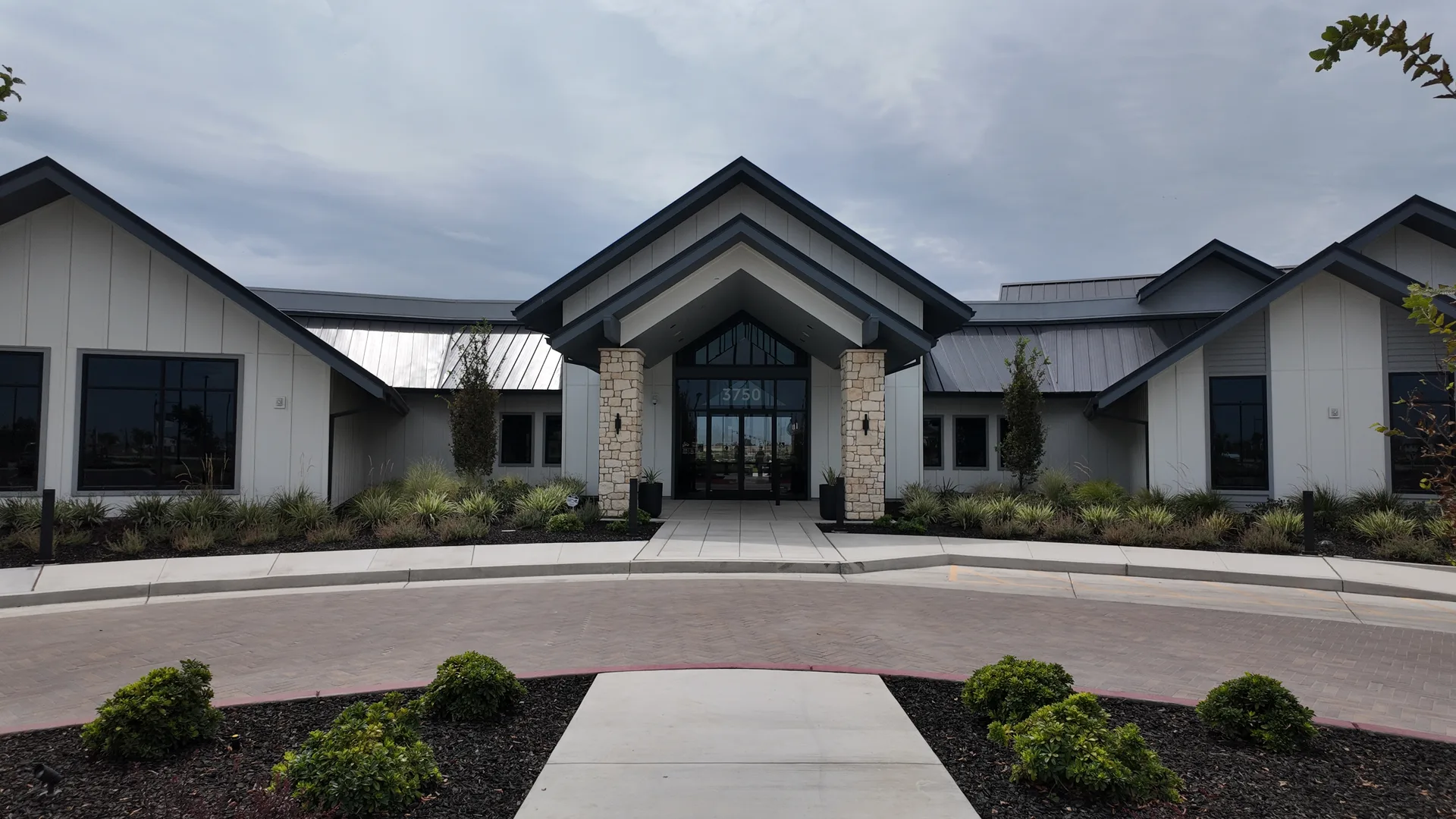 The Lakeview Club clubhouse exterior at Del Webb at River Islands, the 55+ community in Lathrop, California, photographed from the air