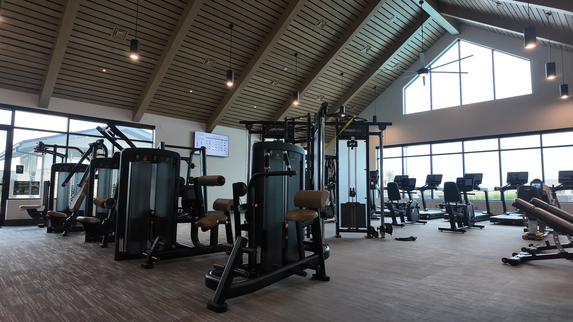 Fitness studio at the Lakeview Club at Del Webb at River Islands in Lathrop, California, with exercise mats, an open mirrored floor, blocks and stability balls set up for group classes