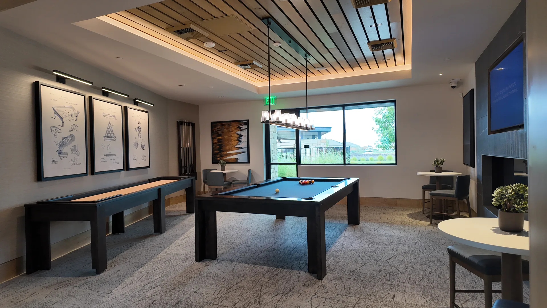 Game room at the Lakeview Club at Del Webb at River Islands in Lathrop, California, with a pool table, shuffleboard and social seating around the room