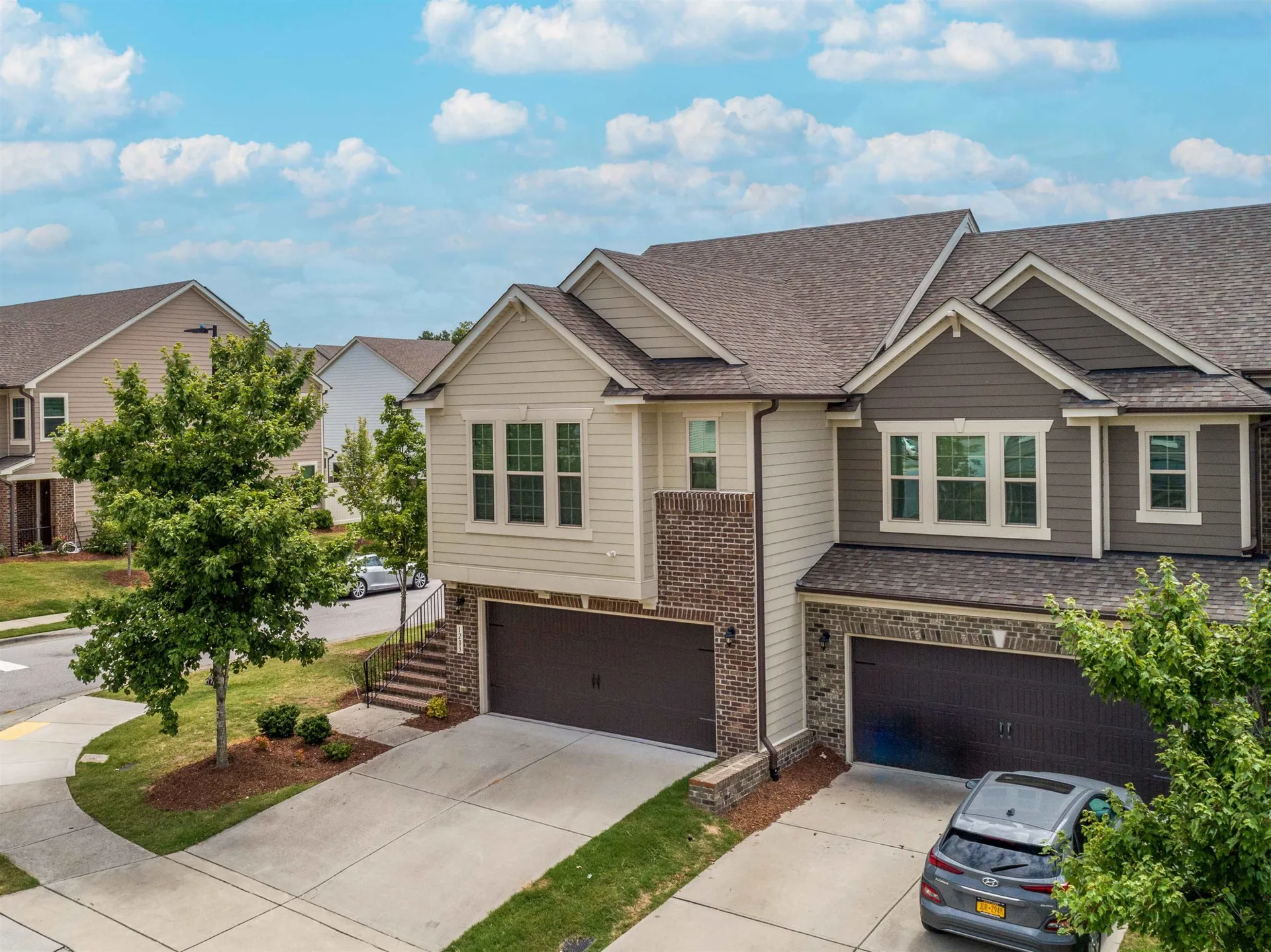 Modern two-story townhome development with grey siding in South Durham