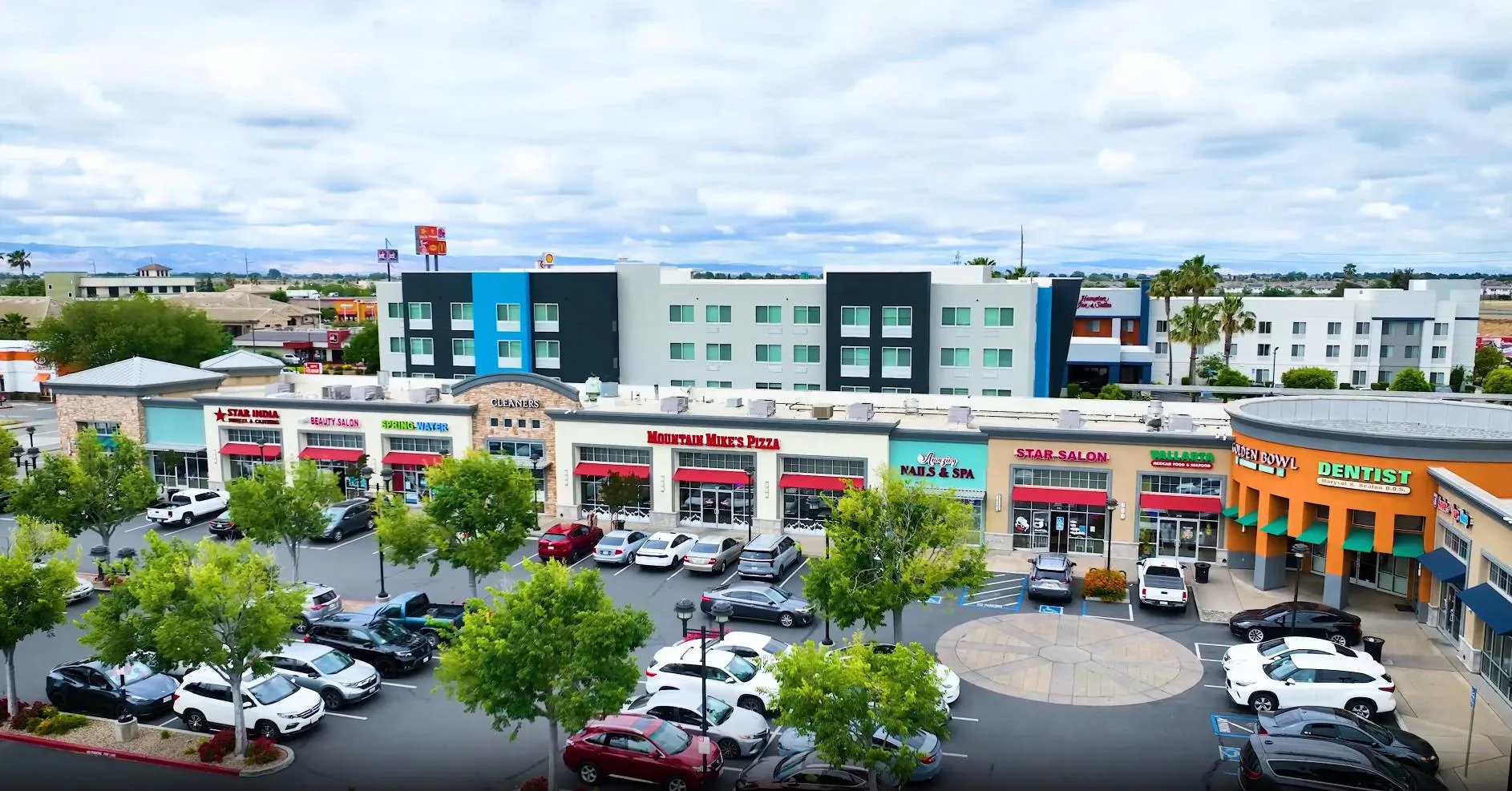 The commercial plaza at River Islands in Lathrop, California, with Mountain Mike's Pizza, a nail salon and a dental office among the storefronts