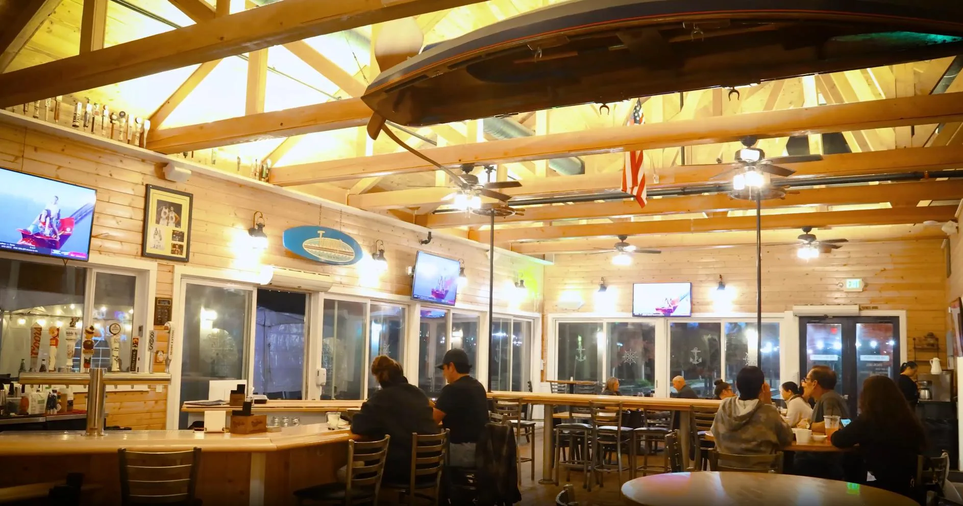 Inside the Boathouse restaurant at River Islands in Lathrop, California, with nautical decor and a canoe mounted overhead