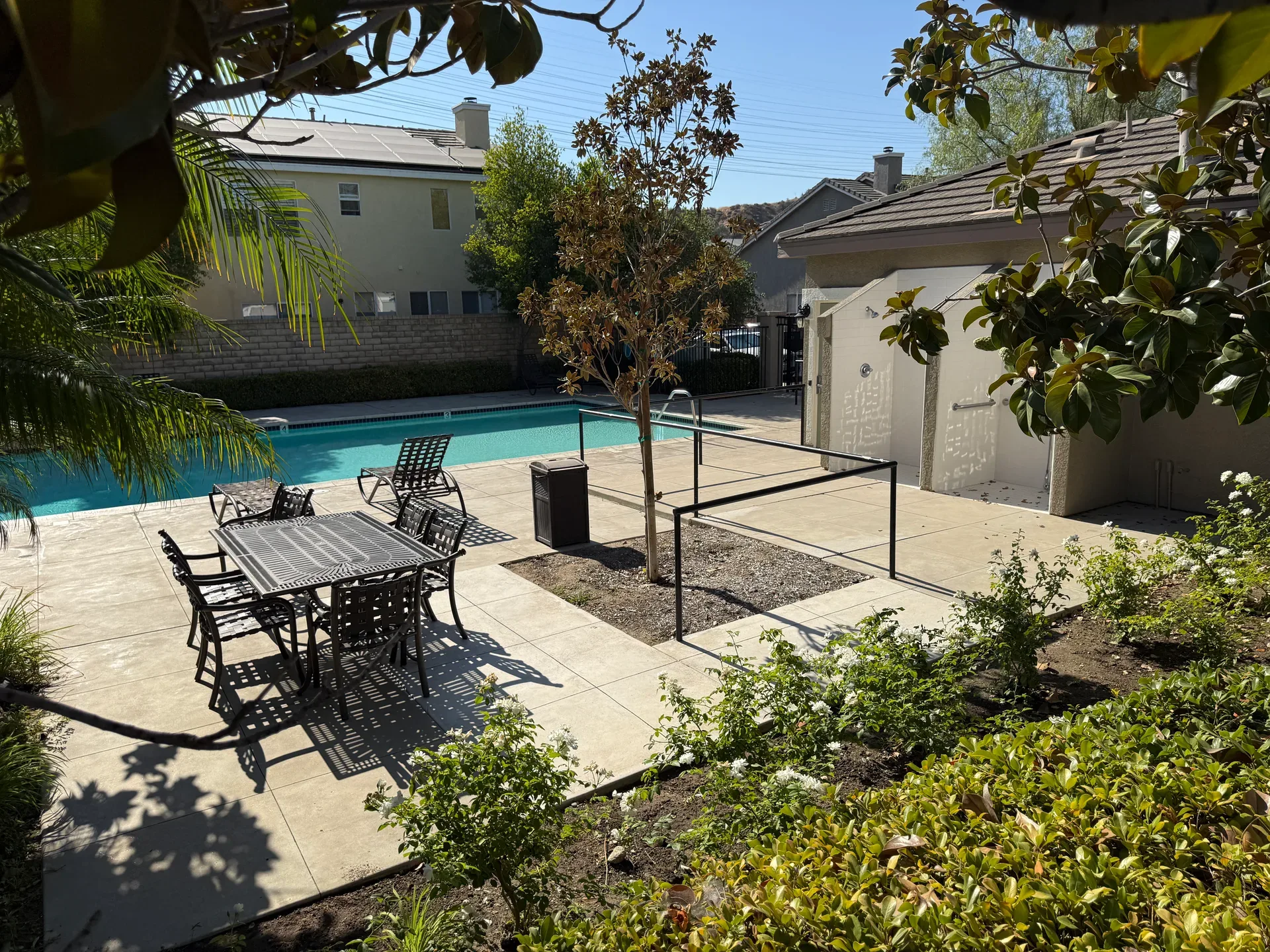Pool area with hardscaped concrete patio