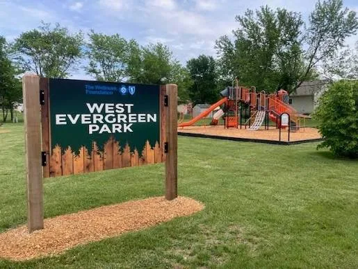 West Evergreen Park sign at the Lennox, South Dakota park with playground