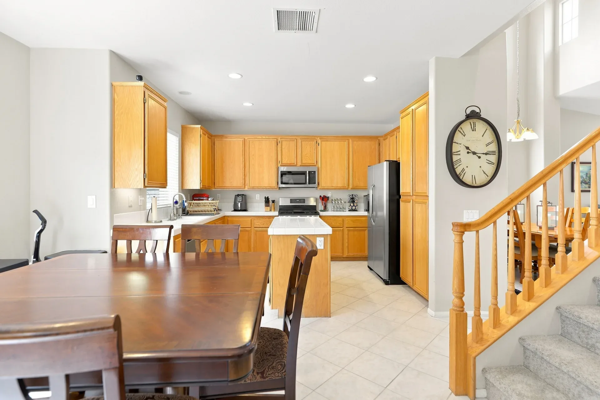 Kitchen and dining area with oak cabinetry in the 28282 Cedar Lane home in Saugus