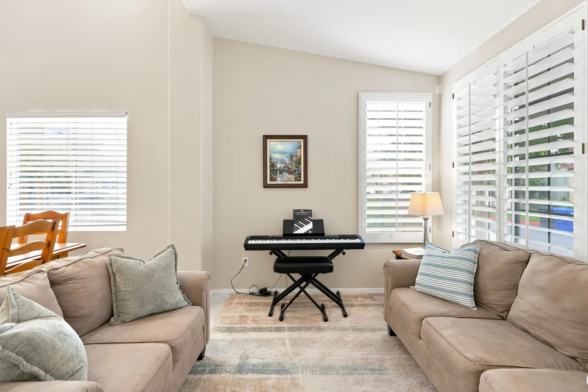Living room space with a piano in the 28282 Cedar Lane home in Saugus