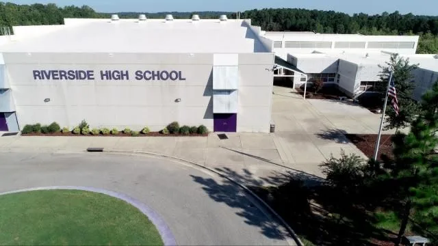 Aerial view of a school campus with athletic fields serving the Trinity Park area