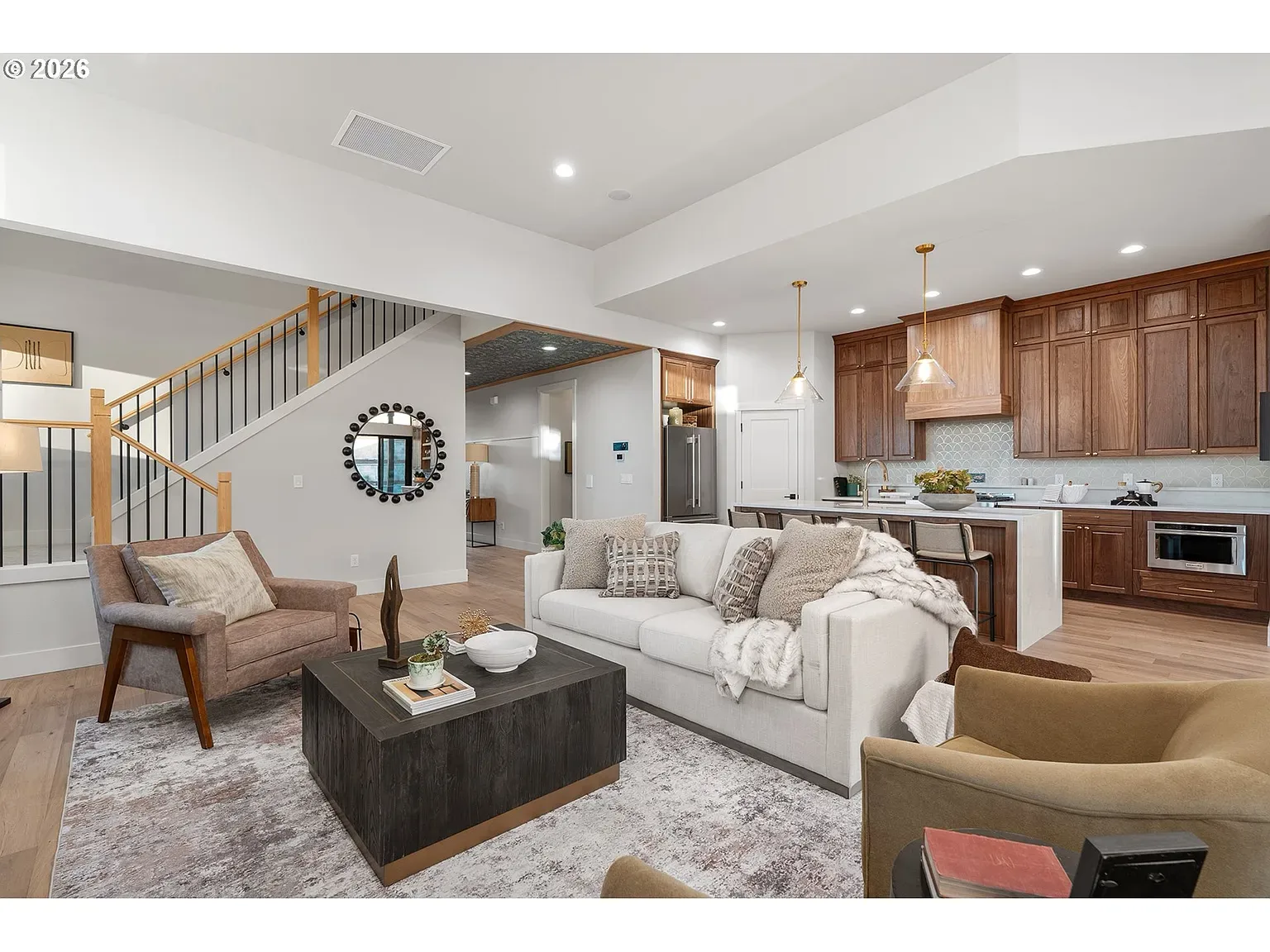 Living, second light: High ceiling, pale oak, and glass opening to the trees