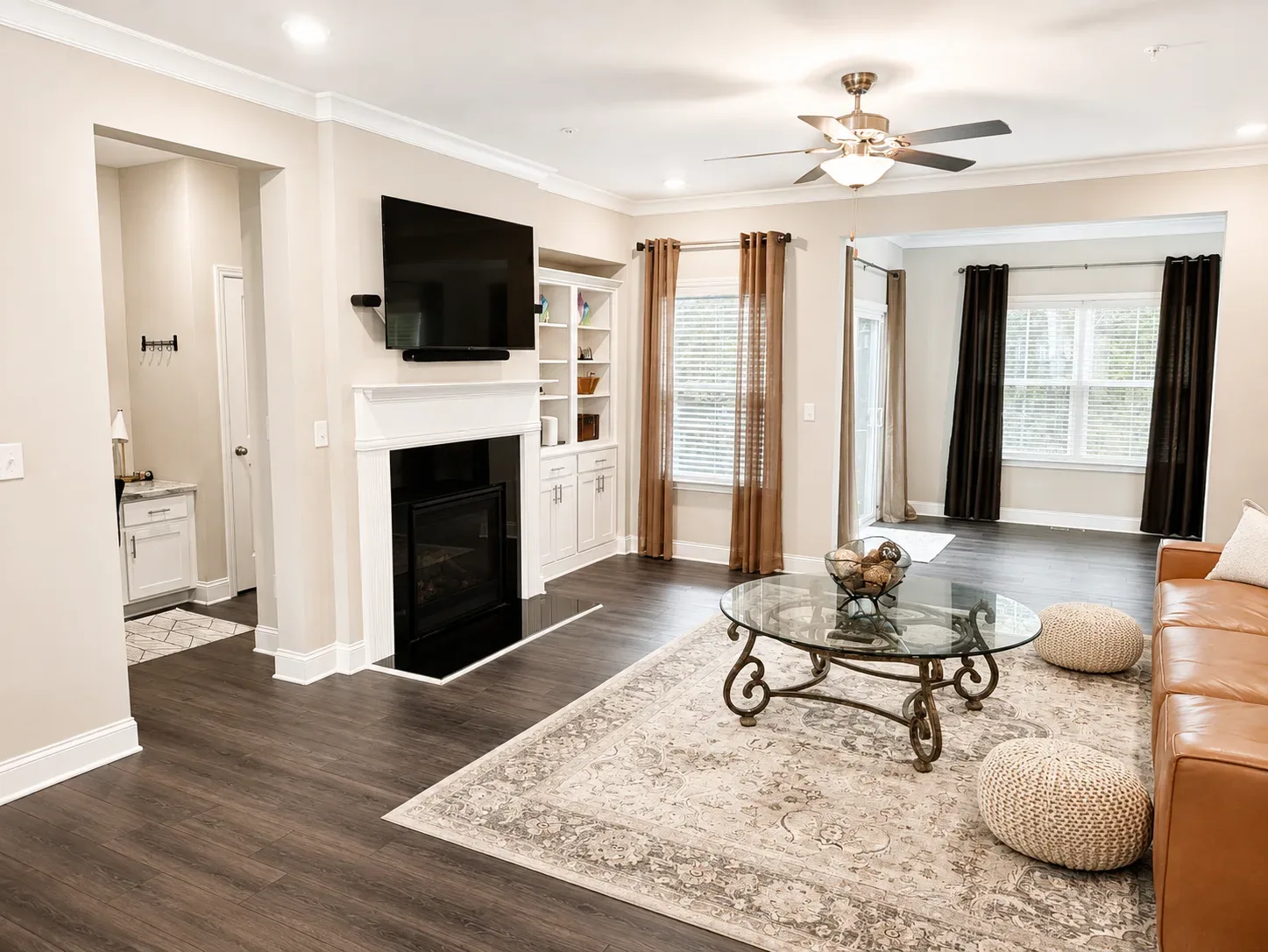 Living room with fireplace and built-in shelving