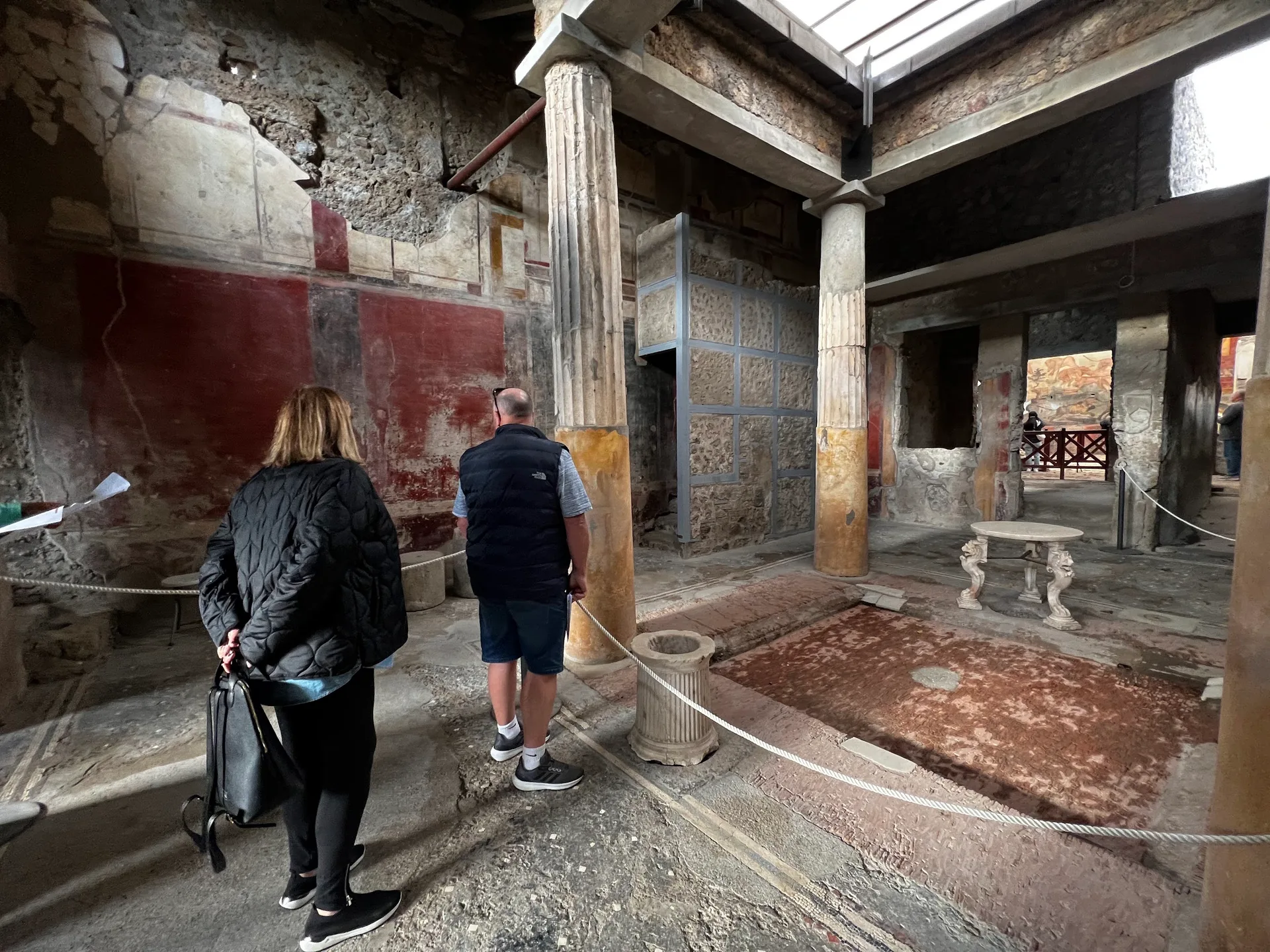 A columned courtyard with painted walls in a Pompeian house