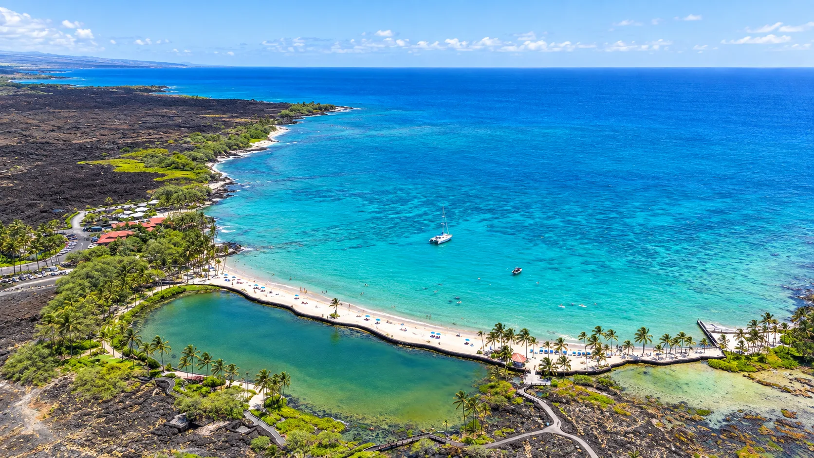 ʻAnaehoʻomalu Bay, A-Bay, the resort’s white-sand beach at the water’s edge